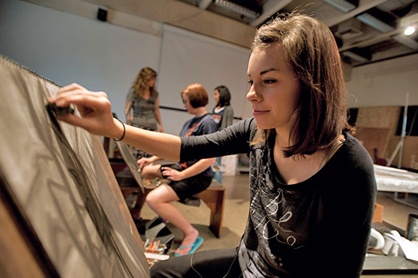 Art students painting in a studio