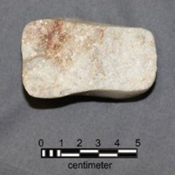 Portion of quartzite stone found at the site.
