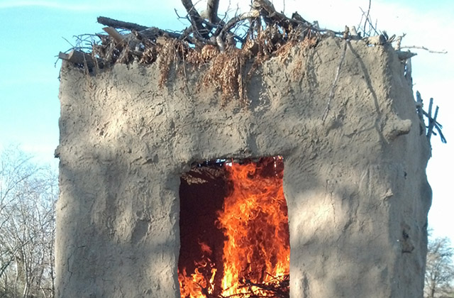 Fire burning in a jacal.
