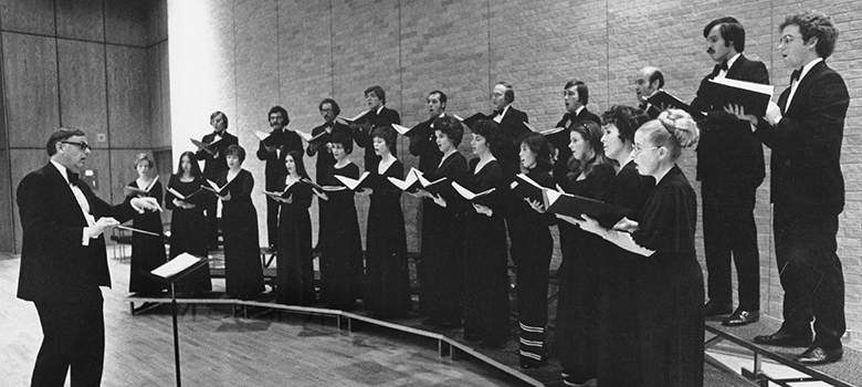 Gordan Lamb (the first director of the UTSA Division of Music) conducts the UTSA Chamber Chorale during the 1976-1977 school year.