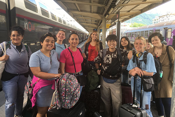 Group of students at a train station