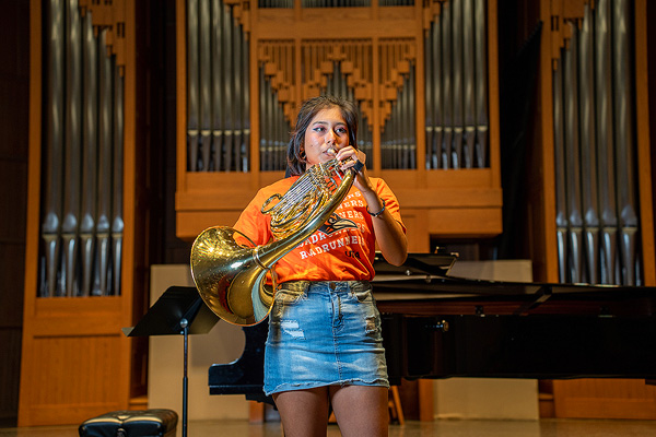 Student playing an instrument