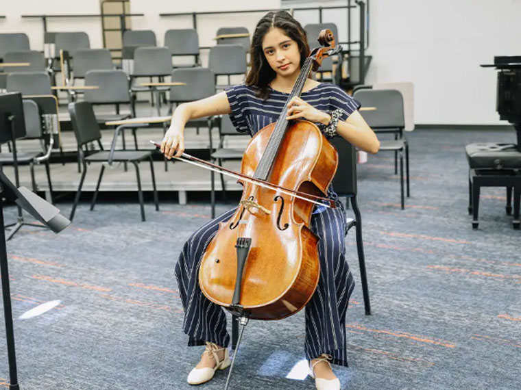 Girl Student playing Chello 