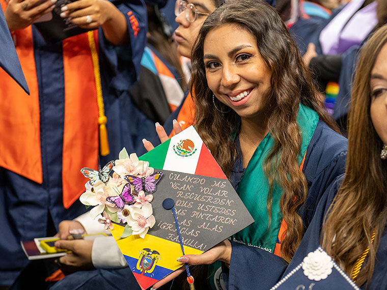 Student showing her cap at commencement