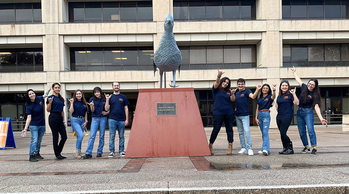 Group photo with roadrunner statue