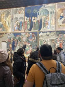 Group of students looking at the Oratorio di San Giovanni Battista