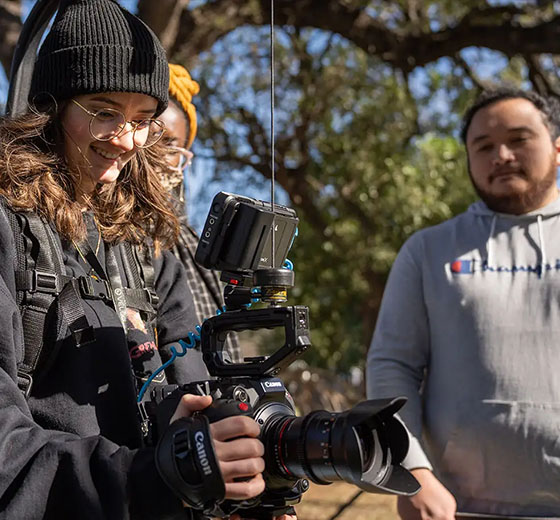 Ireland Robison (left) operates a camera alongside director Nicolas Rodriguez '23 (right) during filming of "The Compass" at City Cemetery #1 in January. The film shoot was part of the UTSA Directors Workshop.