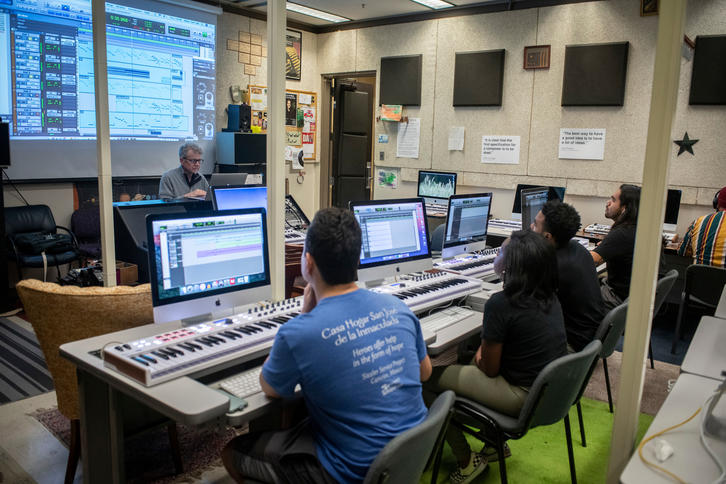 Music technology students learning in a lab setting